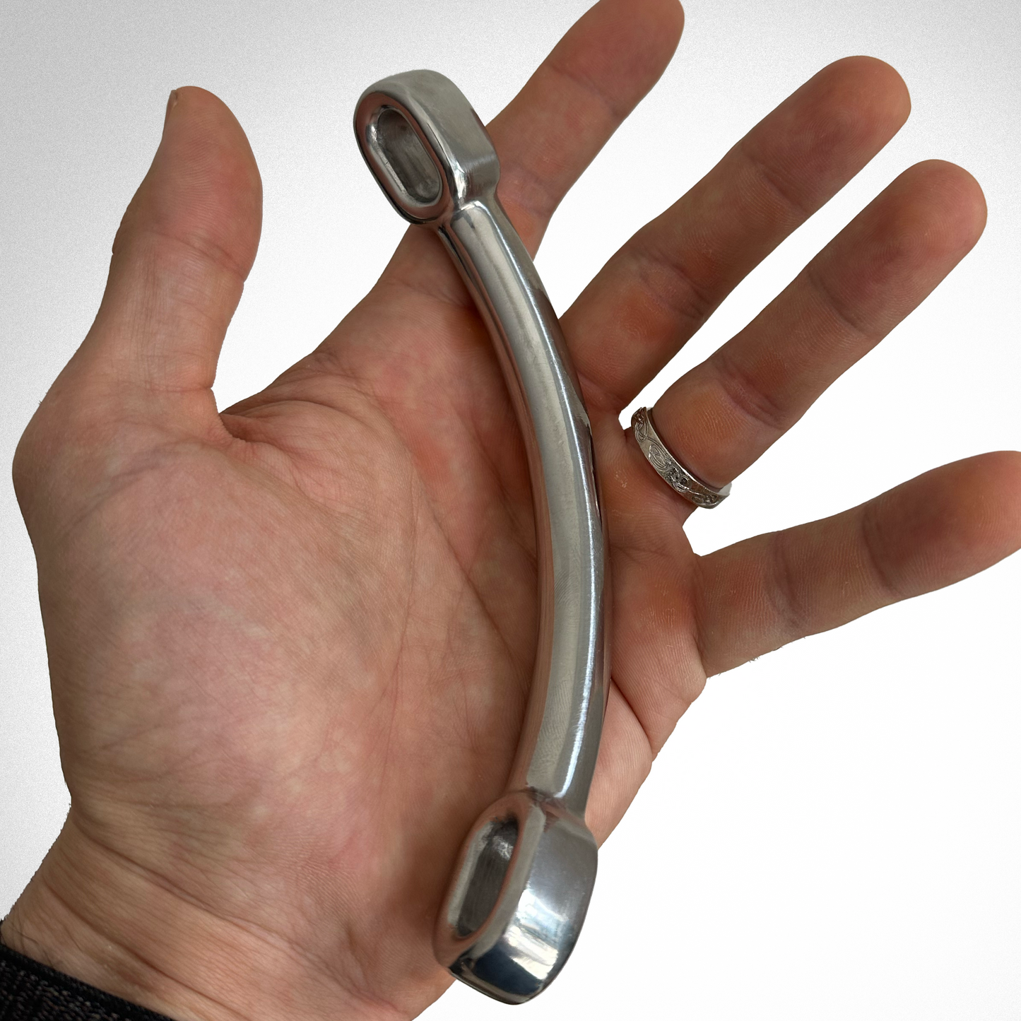 Picture of one rod in the palm of a hand. The rod is about the same size as the hand.